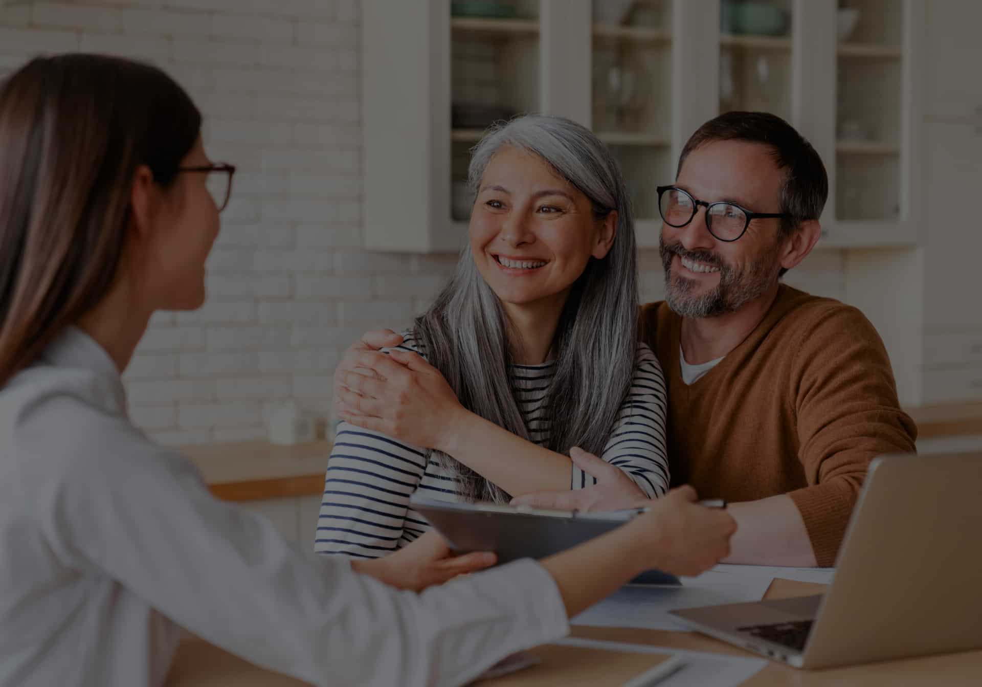 couple talking to insurance agent